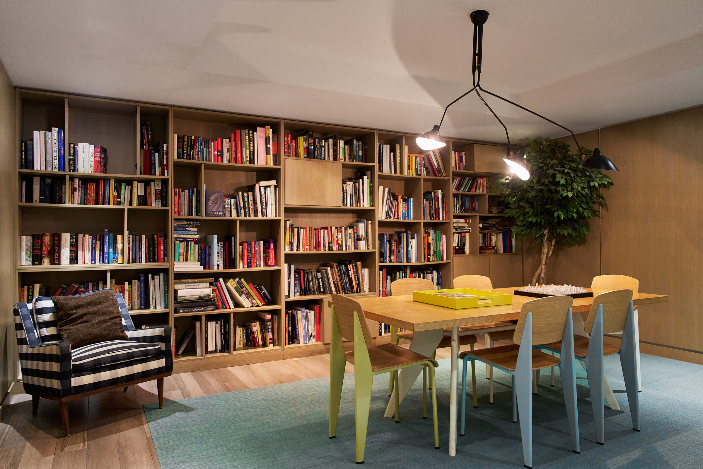 Library and communal worktable at Atlas New York