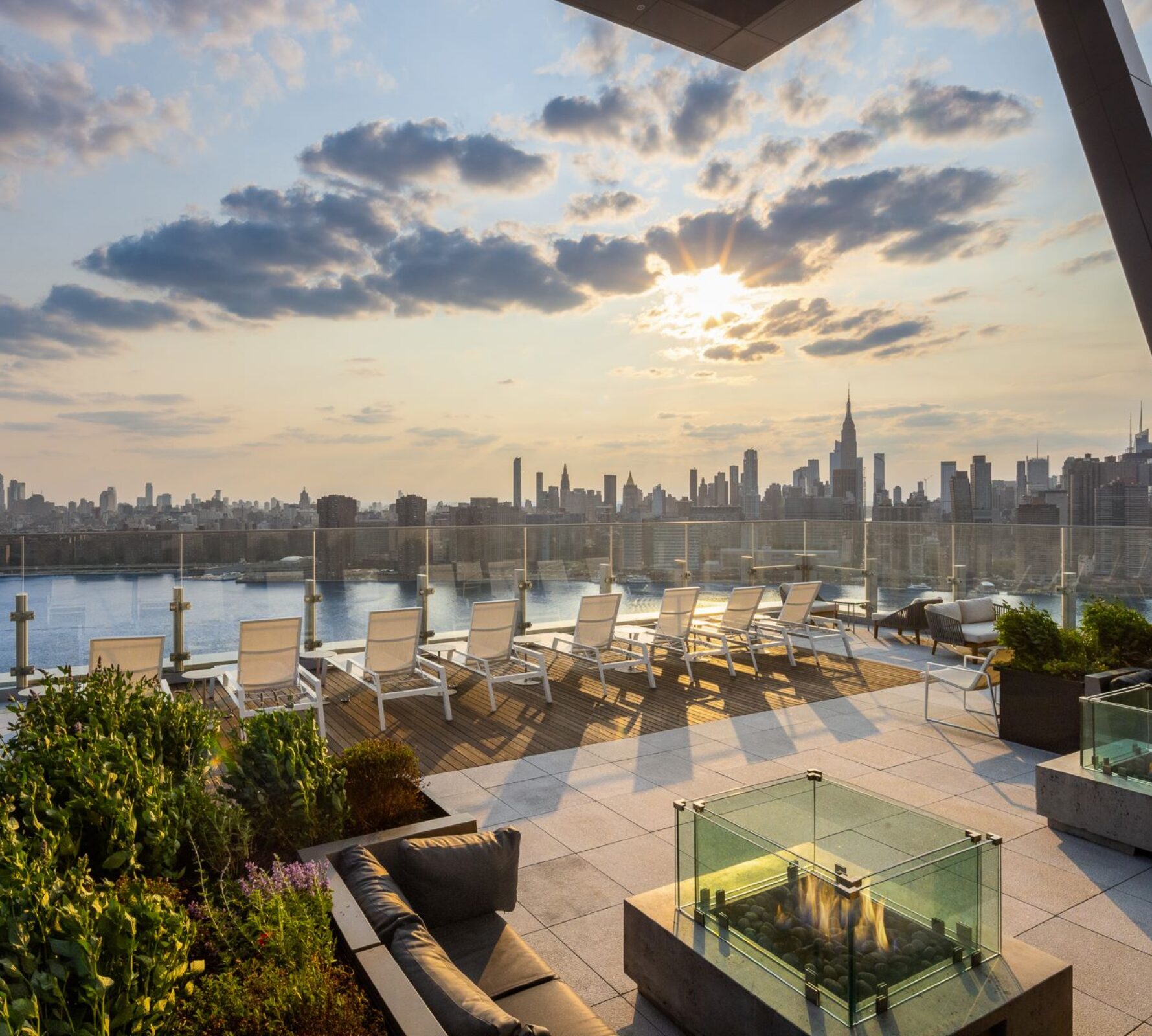 Waterfront rooftop terrace at Gotham Point overlooking the Manhattan skyline