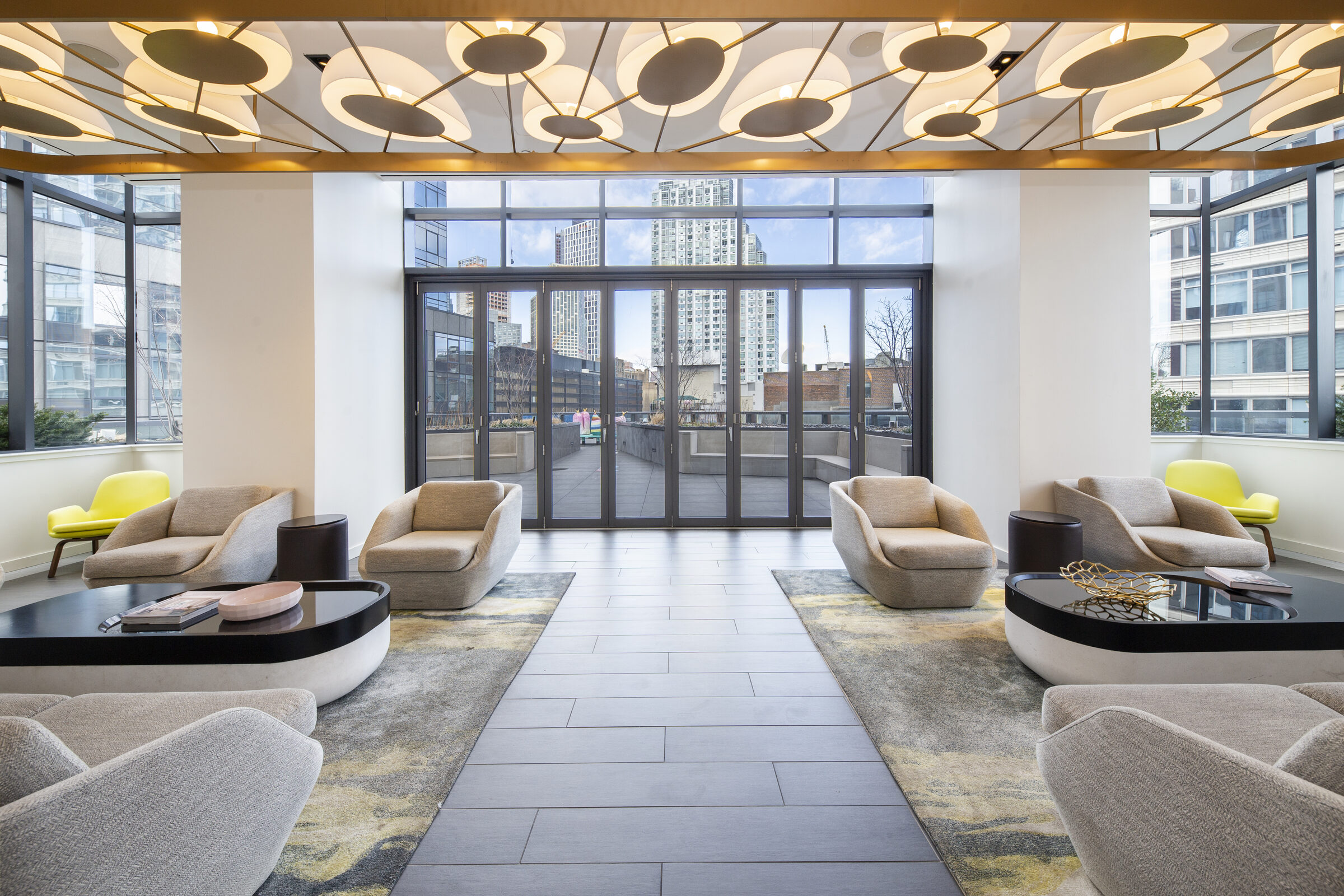 Outdoor fitness area at The Ashland with weights and landscaped planters