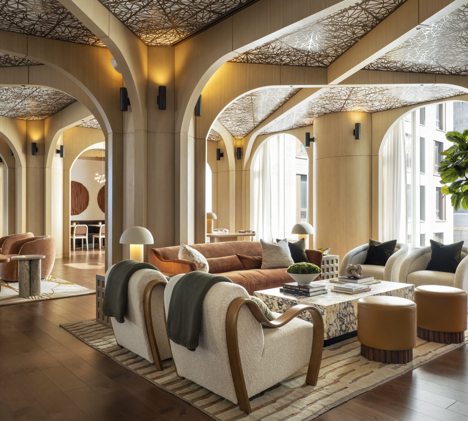 Arched resident lounge at The Maybury with patterned ceilings and curved seating