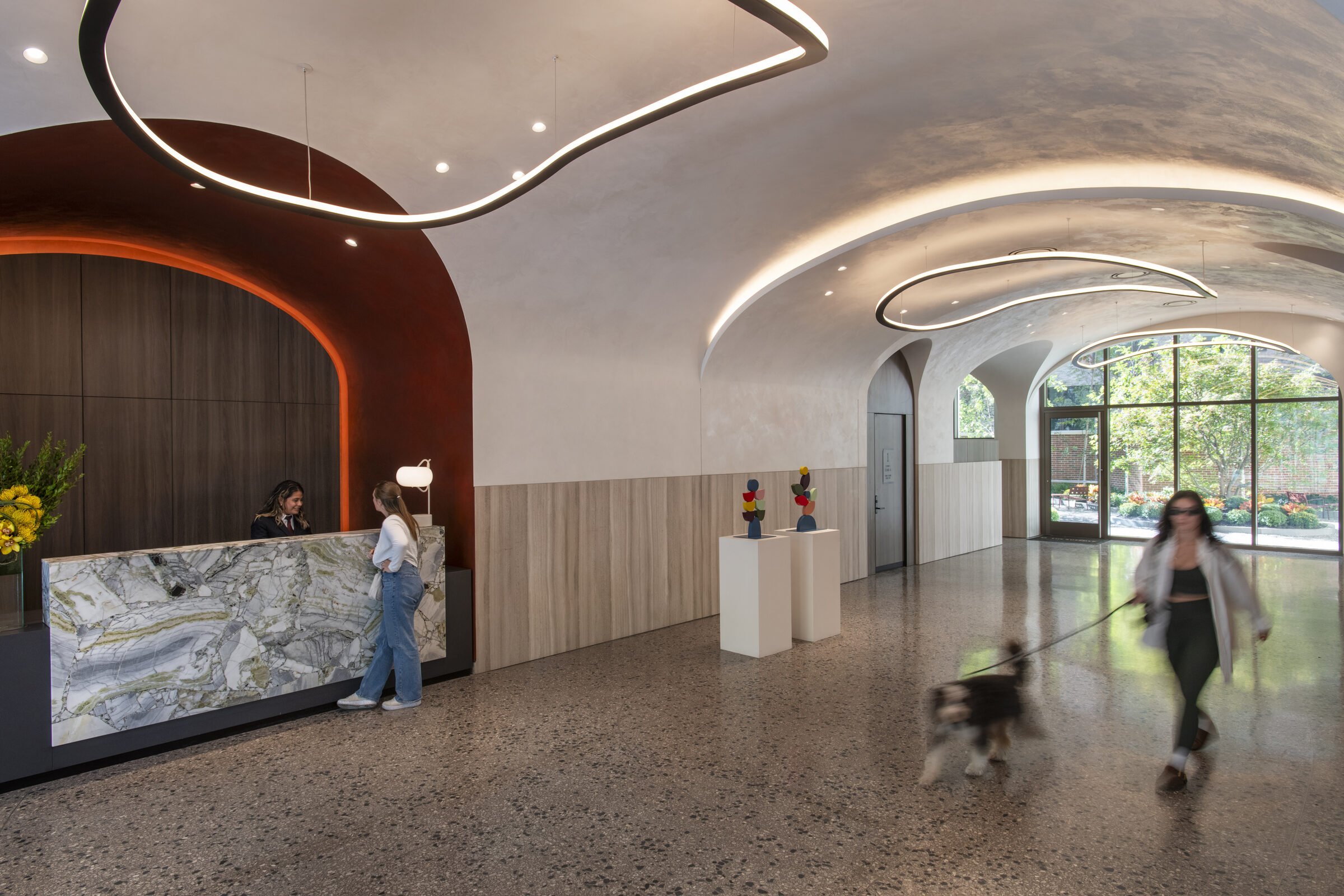 Curved reception lobby at The Suffolk with a sculptural ceiling
